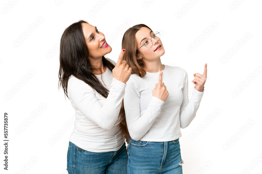 mother and daughter over isolated chroma key background pointing up with the index mother and daughter over isolated chroma key background pointing up with the index