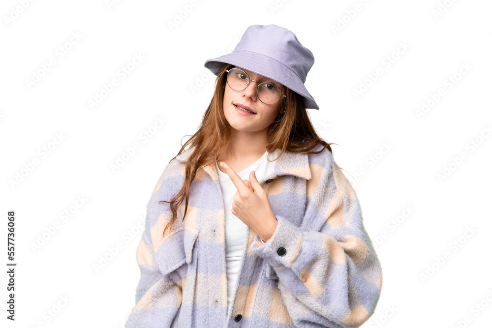 Teenager girl over isolated chroma key background pointing to the side to present a product Teenager girl over isolated chroma key background pointing to the side to present a product