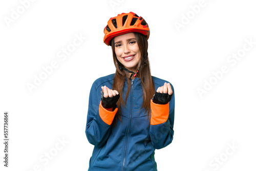 Young cyclist woman over isolated chroma key background making money gesture