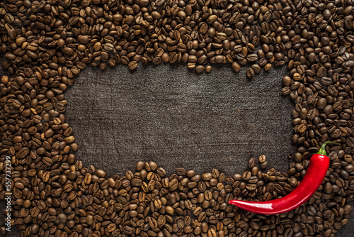 aromatic coffee beans with bitter hot chili pepper on a black background 2