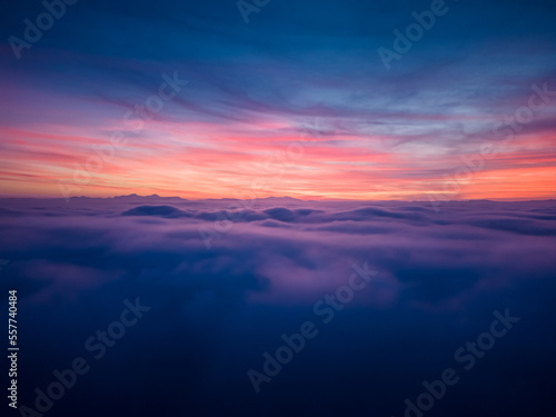 aerial view above the clouds at sunset © cristian
