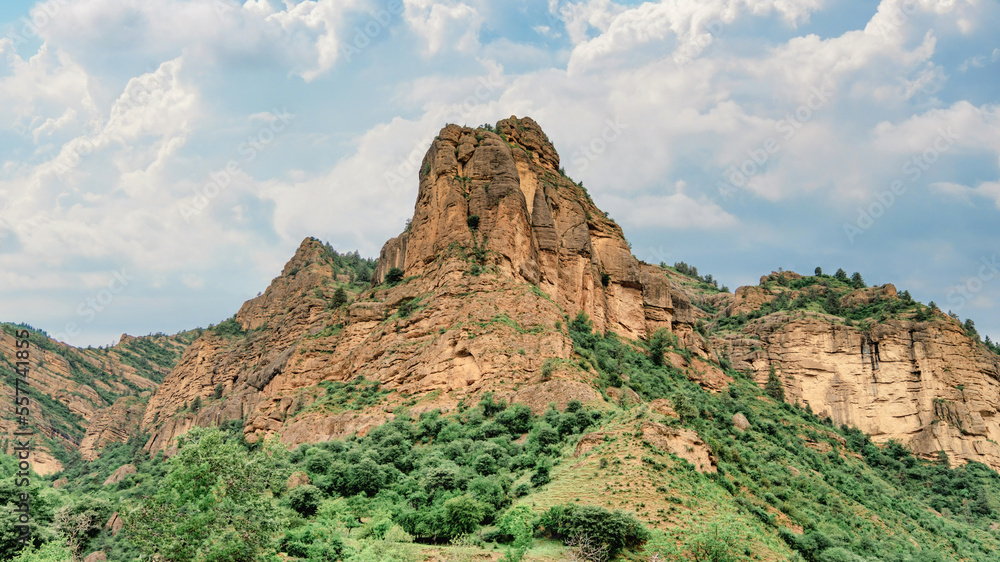 Kyrgyzstan nature green landscape with vast mountains. Kyrgyzstan is a landlocked country located in central Asia, known for its rugged, mountainous terrain and verdant grasslands.