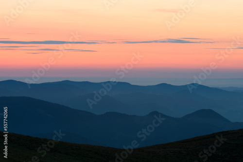 Silhouettes of mountains. View of mountain peaks at dawn.