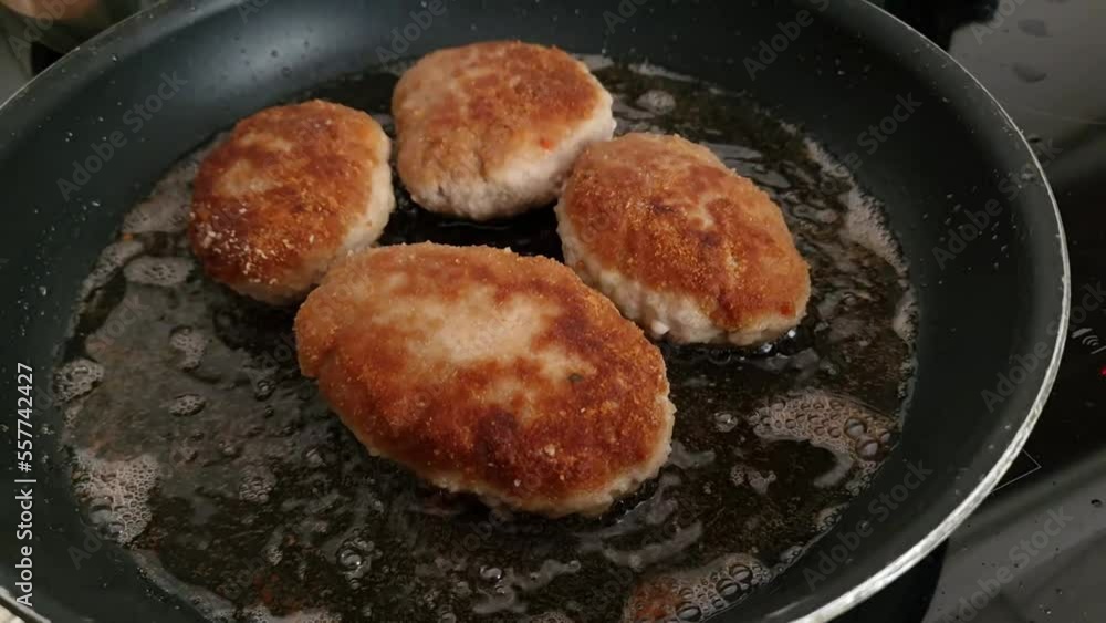 The process of cooking and roasting beef meat cutlets in a frying pan. Food preparation, homemade cuisine, traditional Polish dish The process of cooking and roasting beef meat cutlets in a frying pan. Food preparation, homemade cuisine, traditional Polish dish