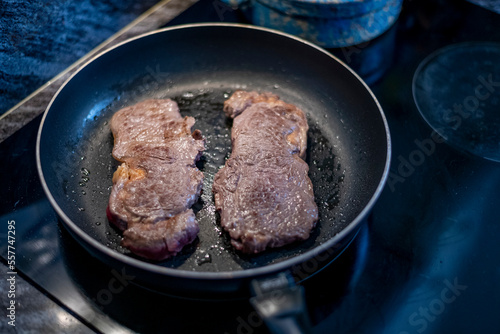 Steak in a pan frying