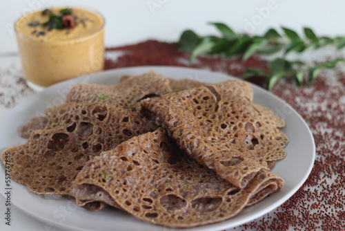 Instant Finger Millet Dosa, made with finger millet flour, curd and spices. Served with coconut chilly condiment photo