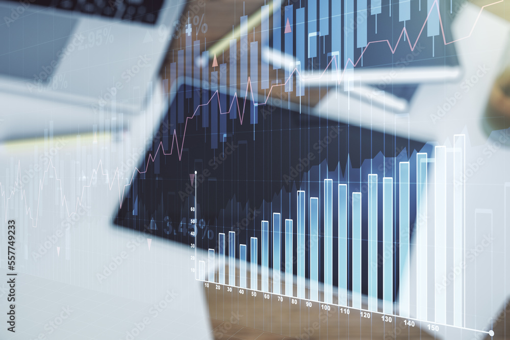 Double exposure of abstract creative financial diagram and modern digital tablet on background, banking and accounting concept Double exposure of abstract creative financial diagram and modern digital tablet on background, banking and accounting concept