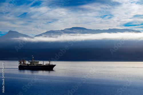 Obraz na płótnie Fishing boat sailing into the port of Neskaupstadur in the fjord of North Iceland w salonie