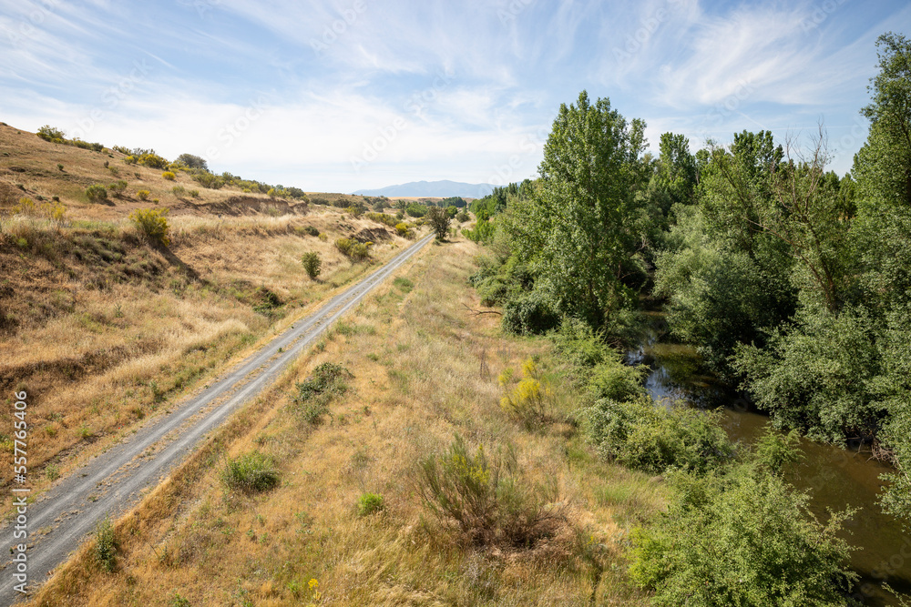 Camino Natural Via Verde del Valle del Eresma - gravel road along Eresma river next to Los Huertos, province of Segovia, Castile and León, Spain