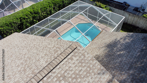 Aerial Drone Photo of House Pool with screen enclosure and Roof Tampa Florida	
