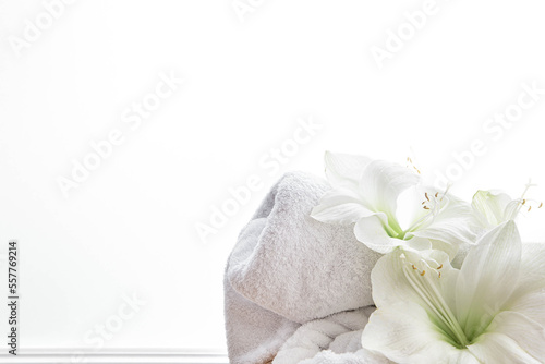 Close-up, lily flowers and a towel on a white background isolated.