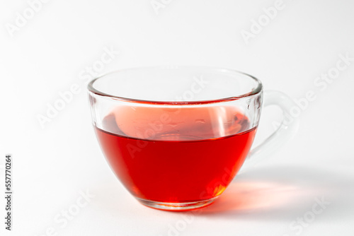 Glass cup with tea on a white background isolated.