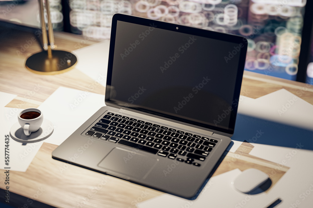 Perspective top view on dark modern laptop monitor with place for your logo or text on light wooden table with coffee mug and night city view background, closeup. 3D rendering, mockup Perspective top view on dark modern laptop monitor with place for your logo or text on light wooden table with coffee mug and night city view background, closeup. 3D rendering, mockup