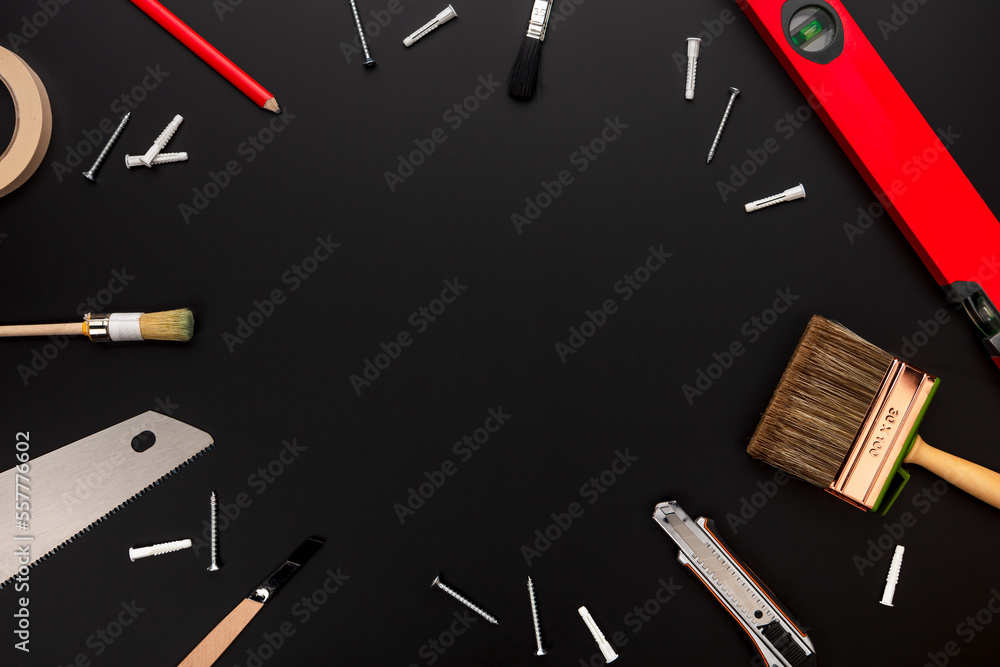 set of tools like hammer and saw for renovating with copyspace 