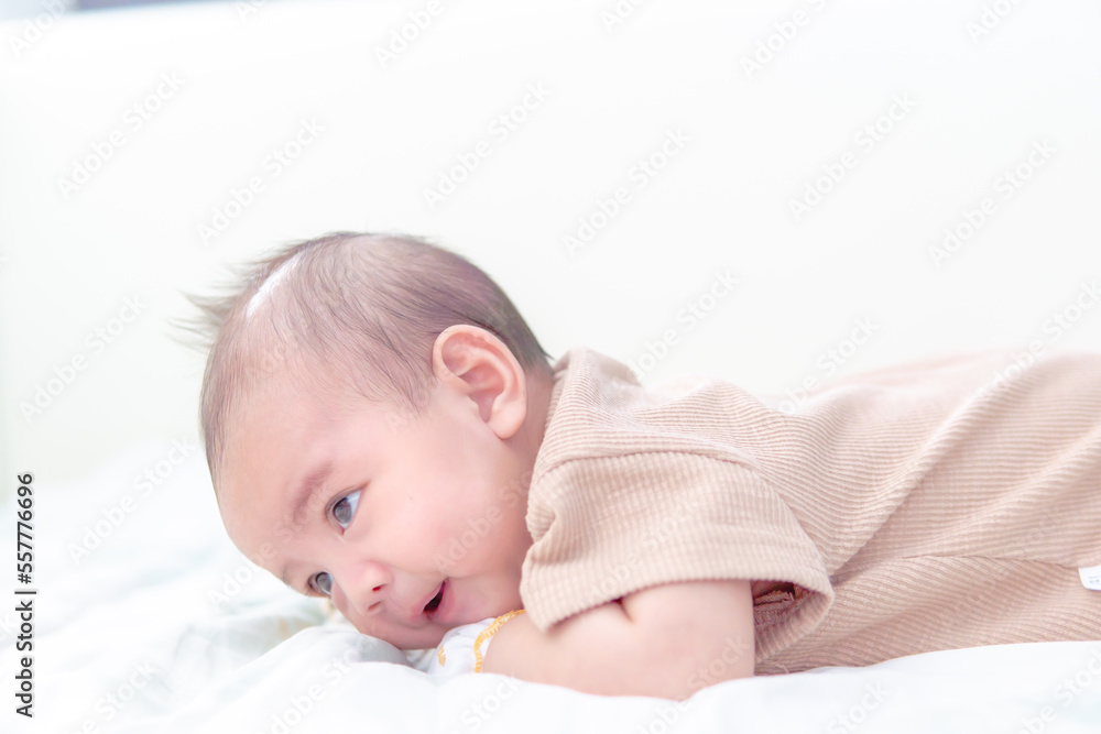 Cute little 3 month, and looking up in prone position, prone baby newborn development training. Cute little 3 month, and looking up in prone position, prone baby newborn development training.
