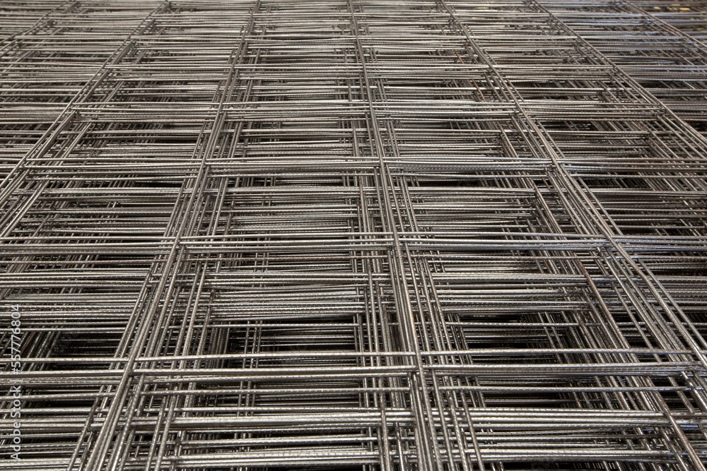 Abstract composition with pile of steel mesh for reinforced concrete