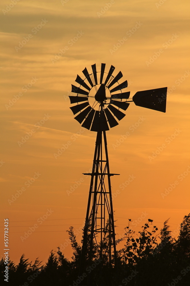 Kansas Farm Windmill at Sunset with clouds Kansas Farm Windmill at Sunset with clouds
