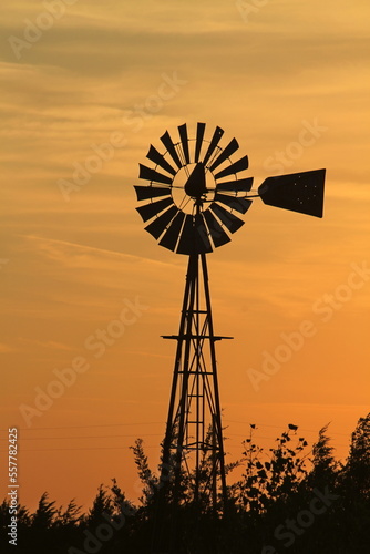 Kansas Farm Windmill at Sunset with clouds