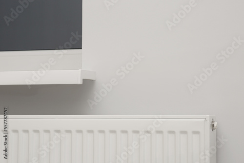 Wallpaper Mural Modern panel radiator under window indoors. Heating system Torontodigital.ca