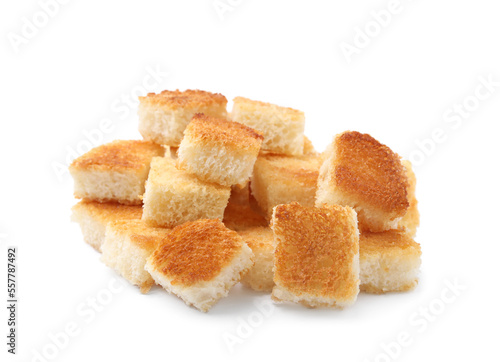 Pile of delicious crispy croutons on white background