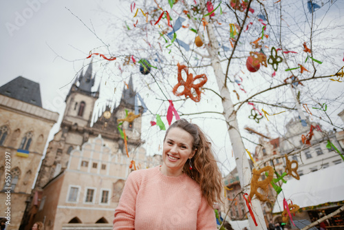 Photography young woman in pink blouse at fair in city