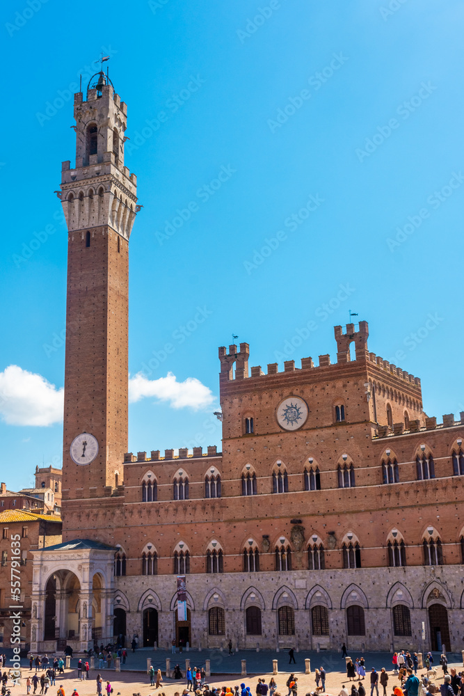 Tourists enjoy Piazza del Campo square in Siena, Italy. The historic centre of Siena has been declared by UNESCO a World Heritage Site.