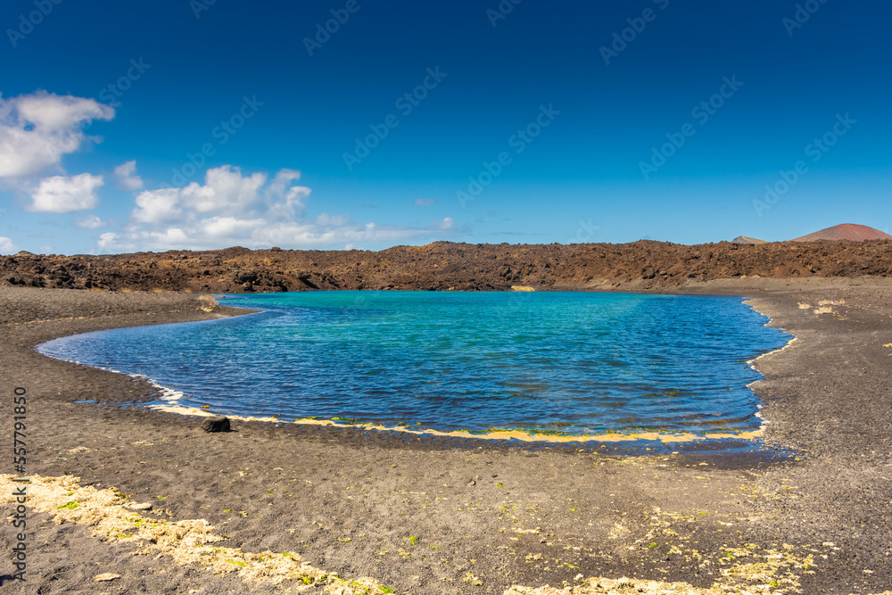 Sulfur lake in front of a volcano in Lanzarote,  Canary Islands, Spain