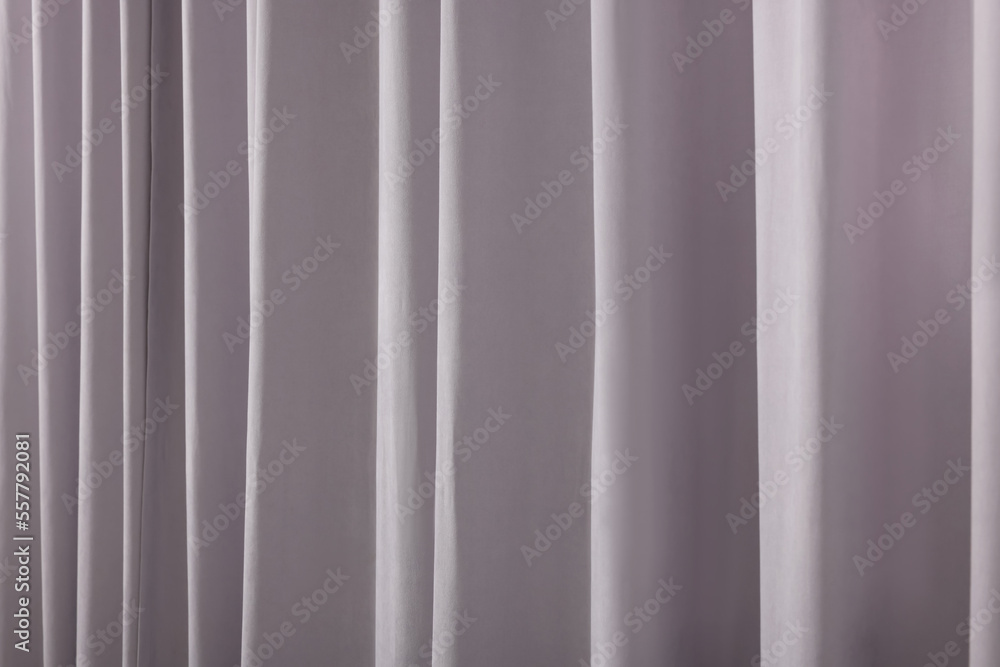 Beautiful light grey window curtains as background, closeup Beautiful light grey window curtains as background, closeup