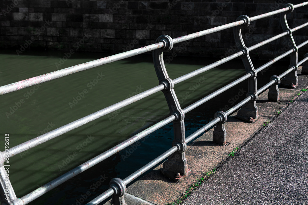 Water canal with balustrade . Waterfront with handrail Water canal with balustrade . Waterfront with handrail