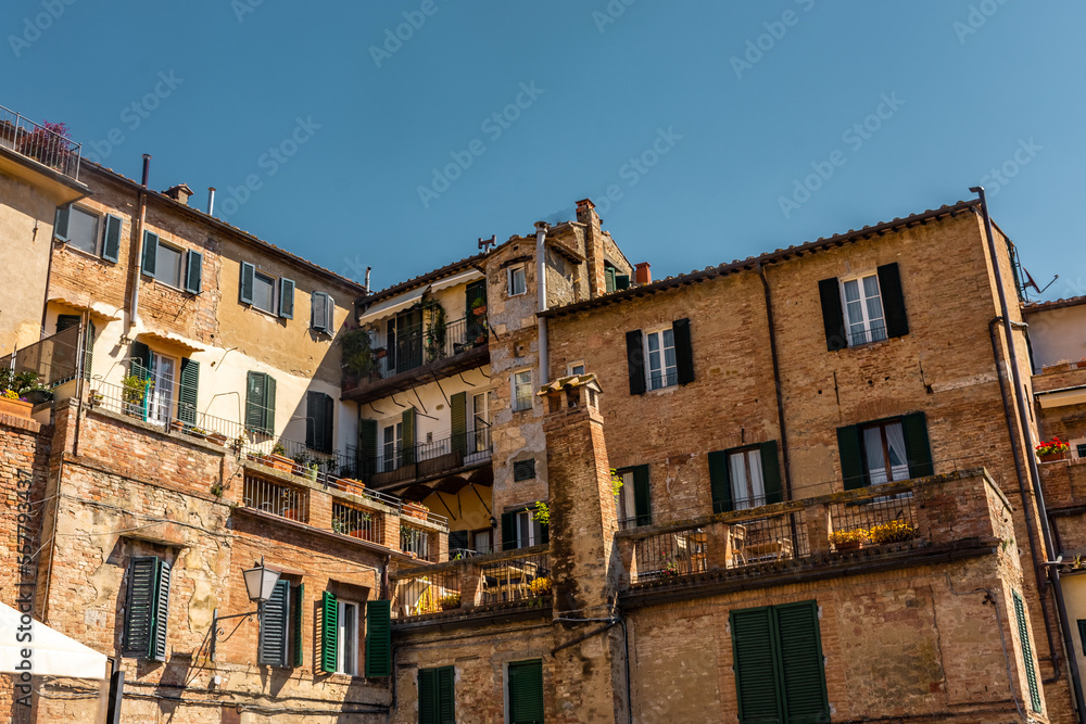 Old medieval buildings in Siena city center, Tuscany,  Italy