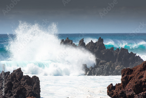 Powerful waves against the sea stacks of Lanzarote island, Atlantic Ocean, Canary Islands in Spain