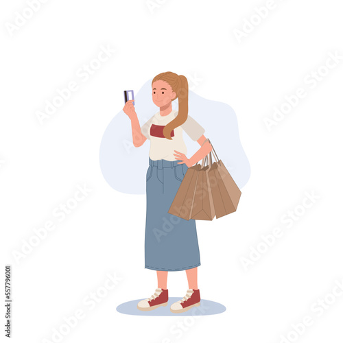 Shopping concept. woman holding a credit card and shopping bags in her hands. Flat cartoon vector illustration