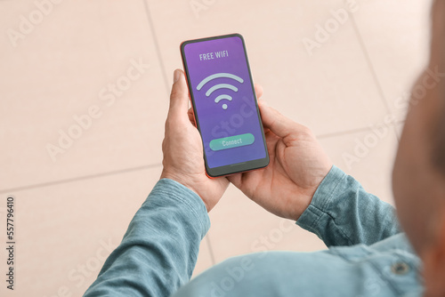 Man holding mobile phone wi...