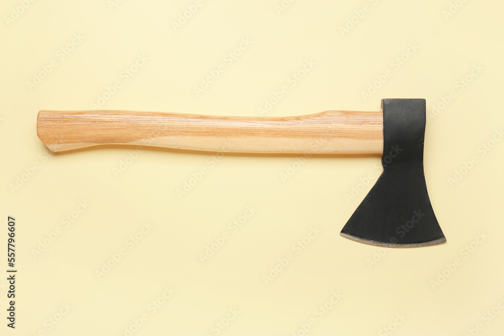 Ax on yellow background, top view