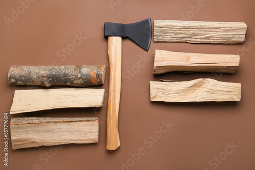 Ax with firewood on brown b...