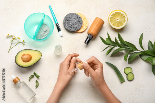 Female hands with bottle of...