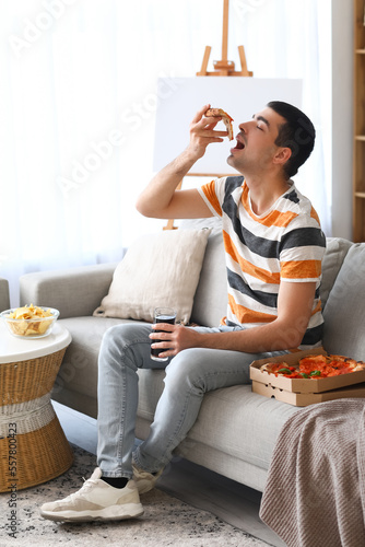 Young man with glass of col...