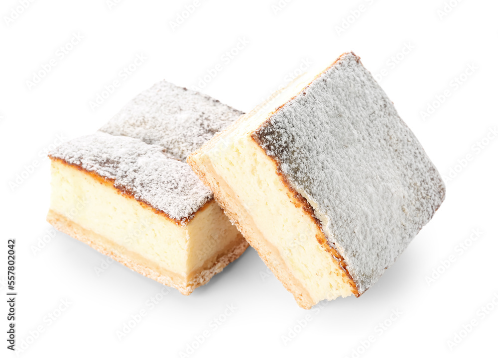 Pieces of delicious cheese pie with sugar powder on white background Pieces of delicious cheese pie with sugar powder on white background