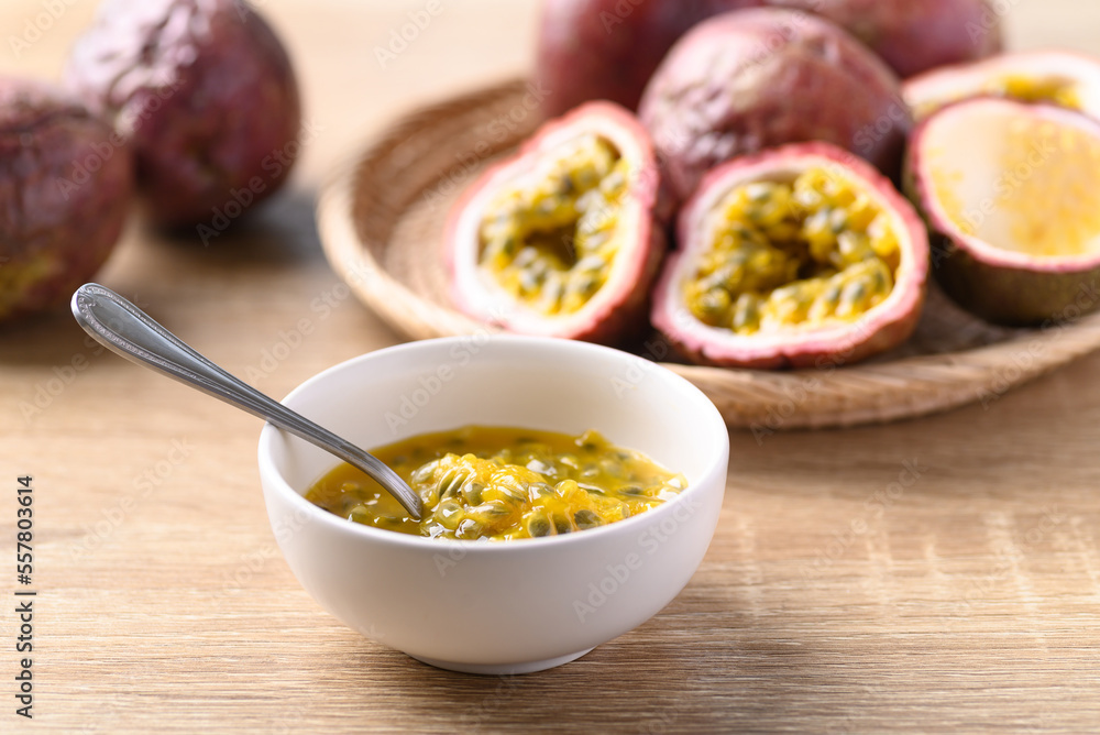 Passion fruit juice in bowl with spoon, food ingredients, Tropical fruit in summer season Passion fruit juice in bowl with spoon, food ingredients, Tropical fruit in summer season