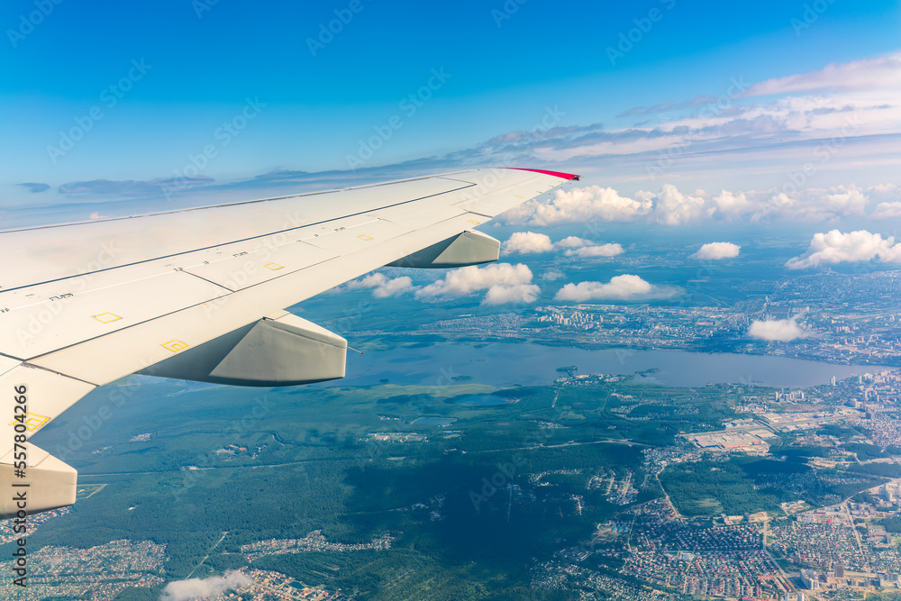 View from the airplane window during taking off on a clear summer morning. Yekaterinburg, Russia View from the airplane window during taking off on a clear summer morning. Yekaterinburg, Russia