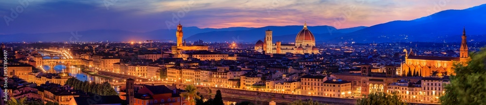Panorama of Duomo Santa Maria del Fiore cathedral, Bell Tower of Giotto and Palazzo Vecchio Tower in Florence, Italy in a colorful sunset, aerial view