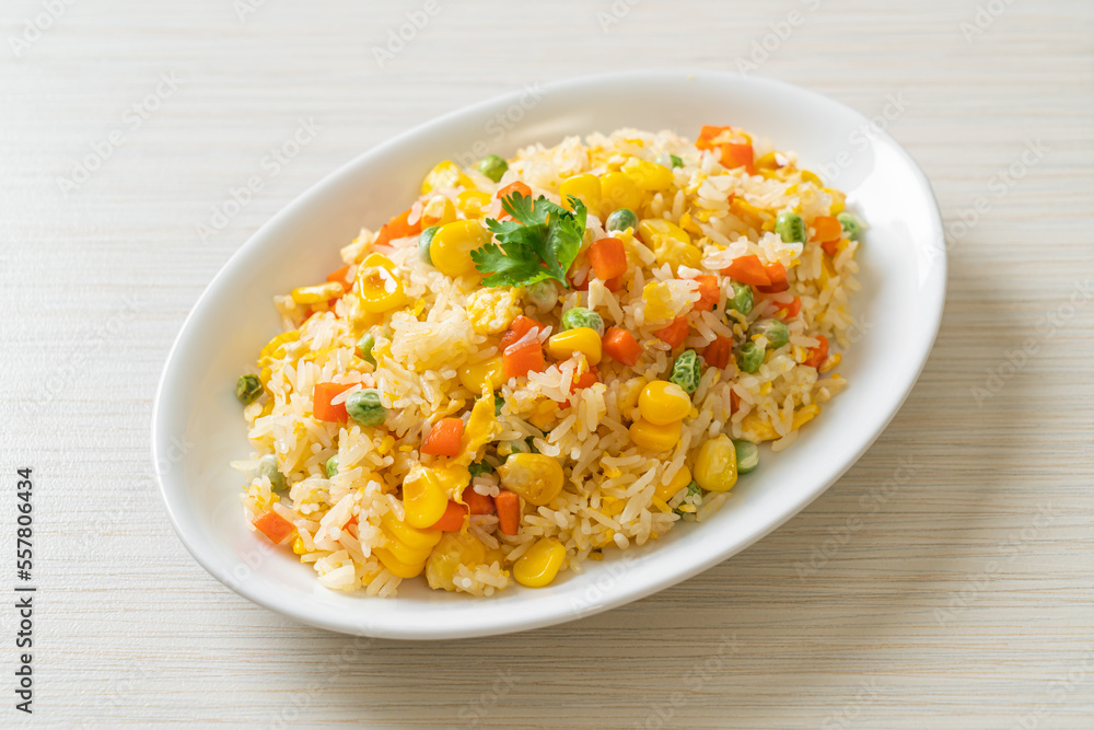 fried rice with mixed vegetable (carrot, green bean peas, corn) and egg fried rice with mixed vegetable (carrot, green bean peas, corn) and egg