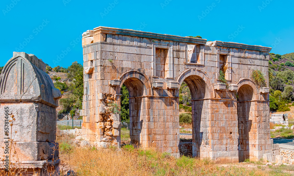 Ancient ruins of gates in Patara - Arch of Modestus in ancient Lycian city Patara - Kas, Antalya, Turkey.
