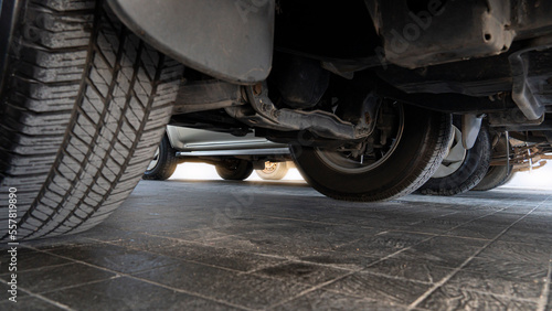 Konstfotografi Abstract under view of undercarriage of the cars in the parking area