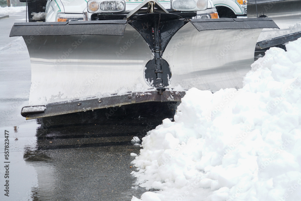 truck with snowplow installed in the parking lots - obrazy, fototapety, plakaty 