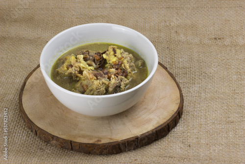 stewed lamb soup served with fried onions photo