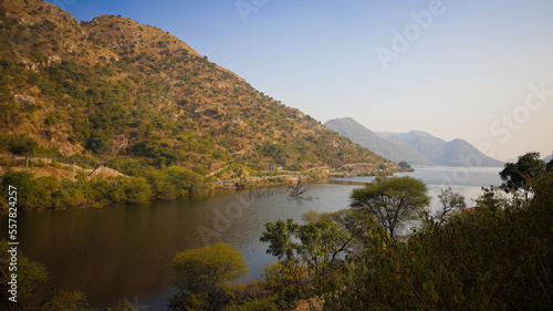 Bahubali Hills, Udaipur, Rajasthan, India 28th December 2022: Popular prewedding destination and trekking spot near Udaipur. 4k Aerial view of Bahubali hill and Badi lake near Barda village