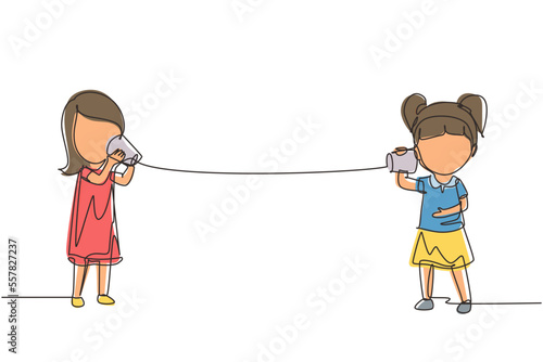 Single one line drawing girls speaking by tin can telephone. Two friends playing in phone with self made speech transmitting device, kids have fun speaking. Continuous line draw design graphic vector