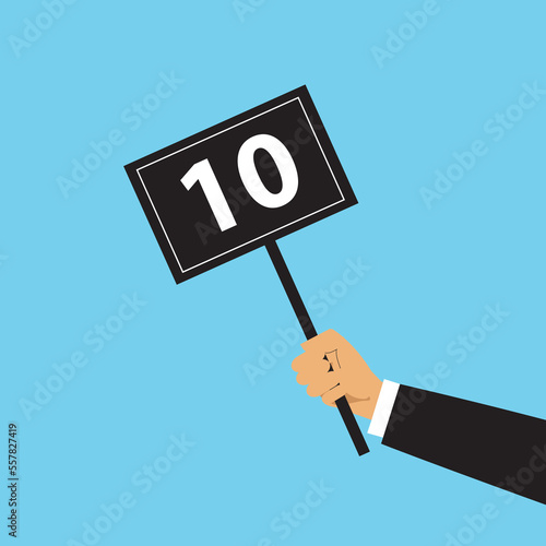 Hand hold round score card banner plate with number 10 business concept flat style design vector illustration. Votes jury judges of tournament or contest. 