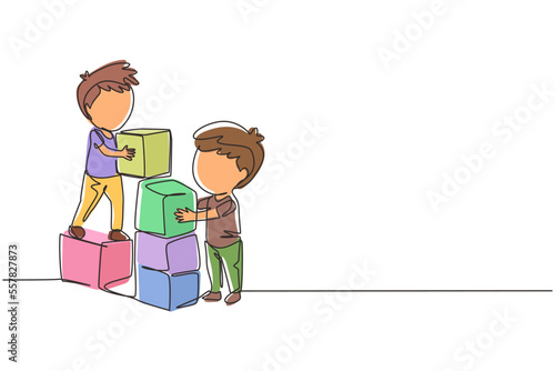 Single one line drawing two little boys playing blocks toys together. Educational toys. Children playing designer cubes, developmental constructor. Continuous line design graphic vector illustration